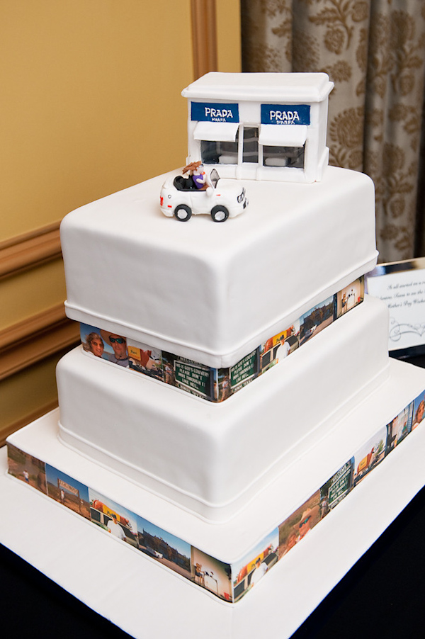 fun white three layered wedding cake with photos of bride and groom as borders and miniature Prada store and couple in wedding car as cake toppers - photo by Houston based wedding photographer Adam Nyholt